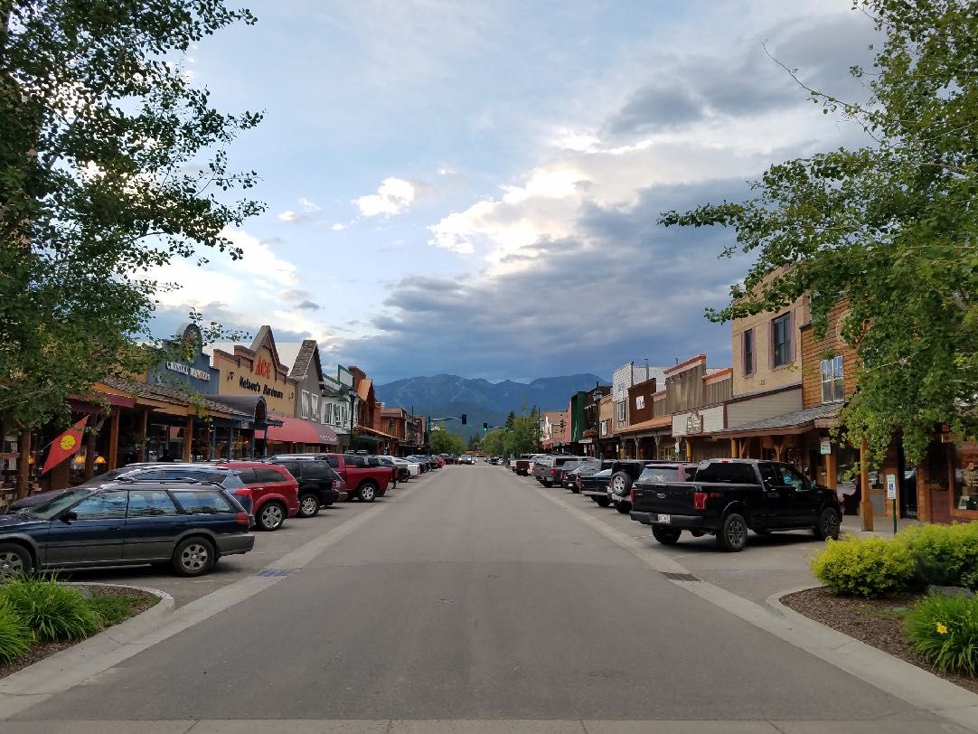 Main street in Whitefish, Montana, with the mountains at the end of the road